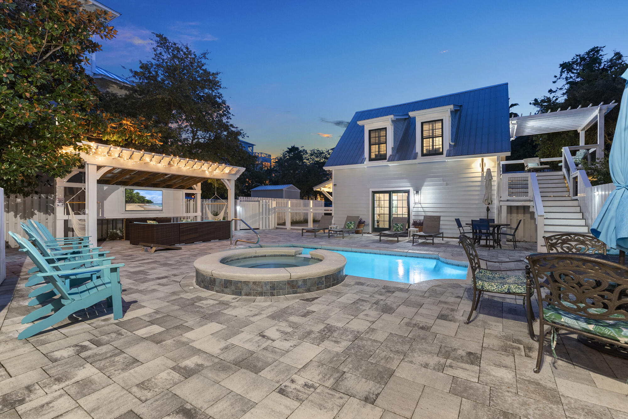 a living room with furniture and a dining table