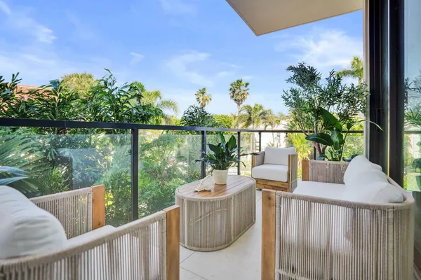 a view of a chairs and table in patio