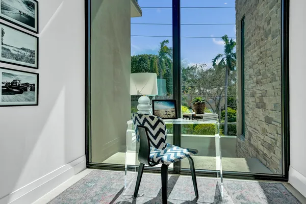 a view of balcony with furniture