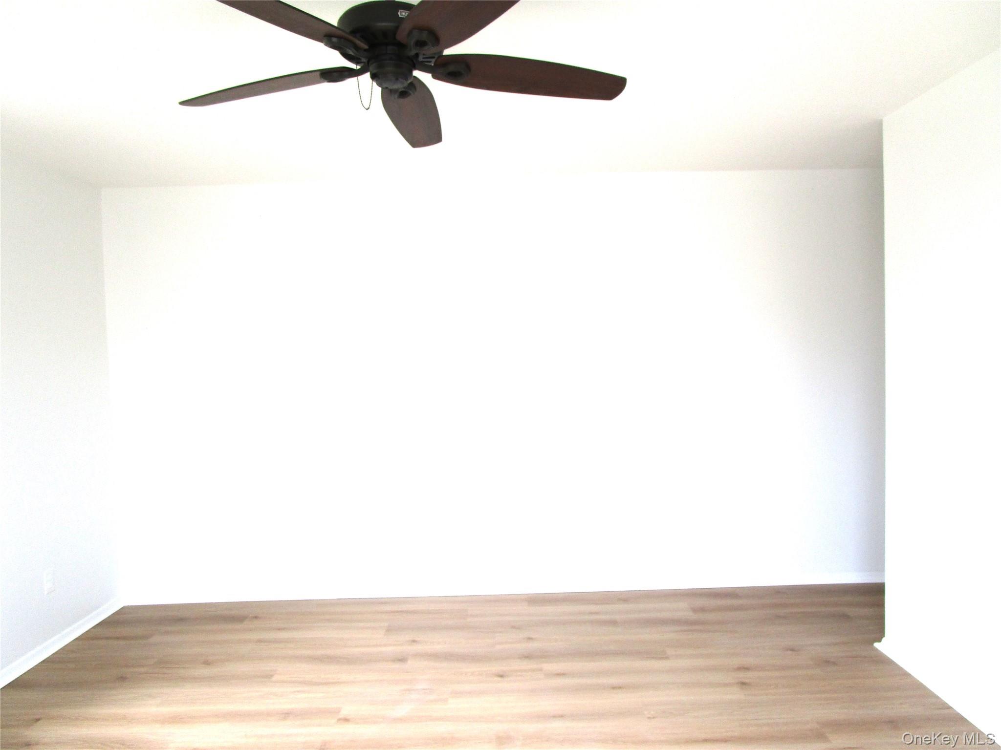 75 Noble Street, Unit 126 Lynbrook, NY 11563 - Photo 28 of 36 a view of an empty room