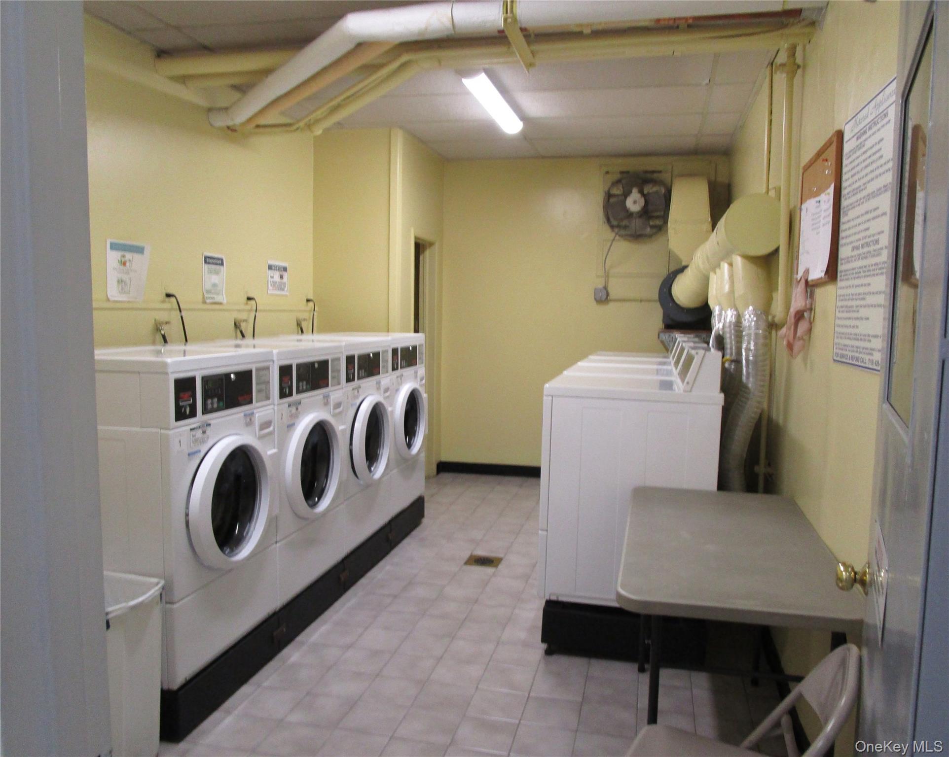 75 Noble Street, Unit 126 Lynbrook, NY 11563 - Photo 33 of 36 a utility room with dryer and washer