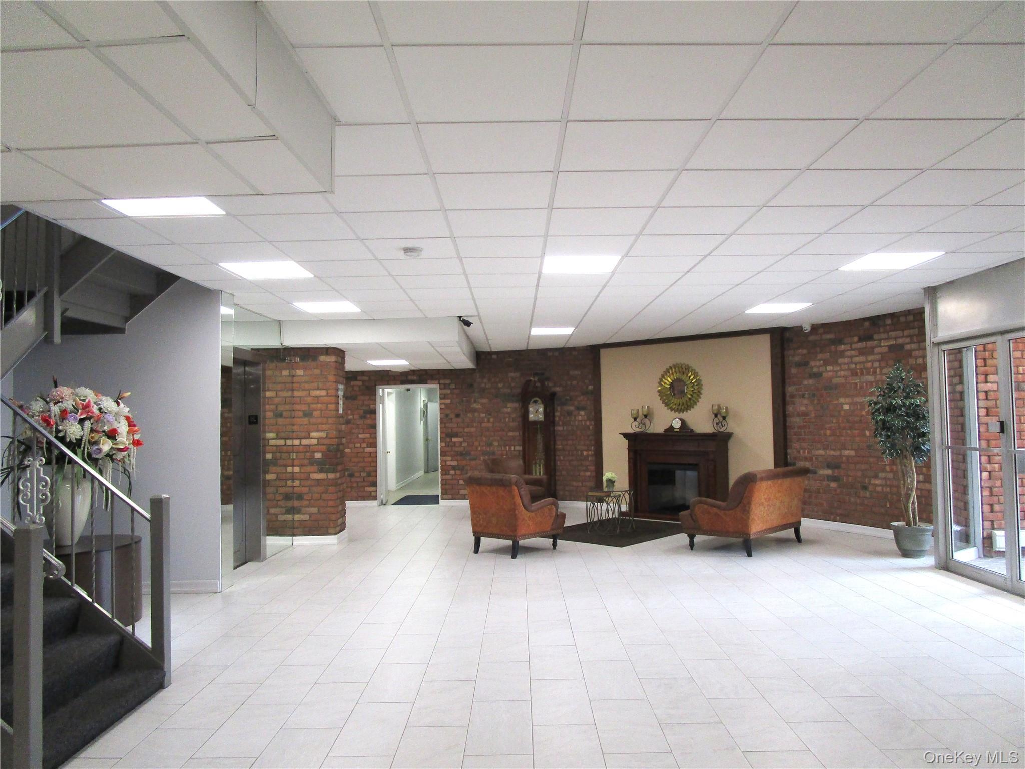 75 Noble Street, Unit 126 Lynbrook, NY 11563 - Photo 5 of 36 a view of a room with gym equipment