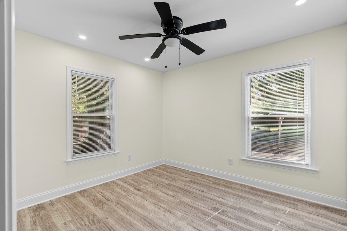 3607 Vanuys Road Memphis, TN 38111 - Photo 19 of 26 a view of an empty room with a window and wooden floor