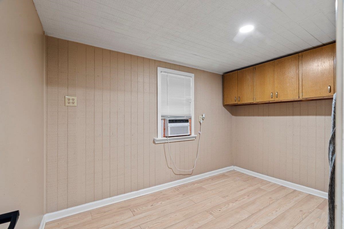 3607 Vanuys Road Memphis, TN 38111 - Photo 20 of 26 a view of an empty room with wooden floor and a window
