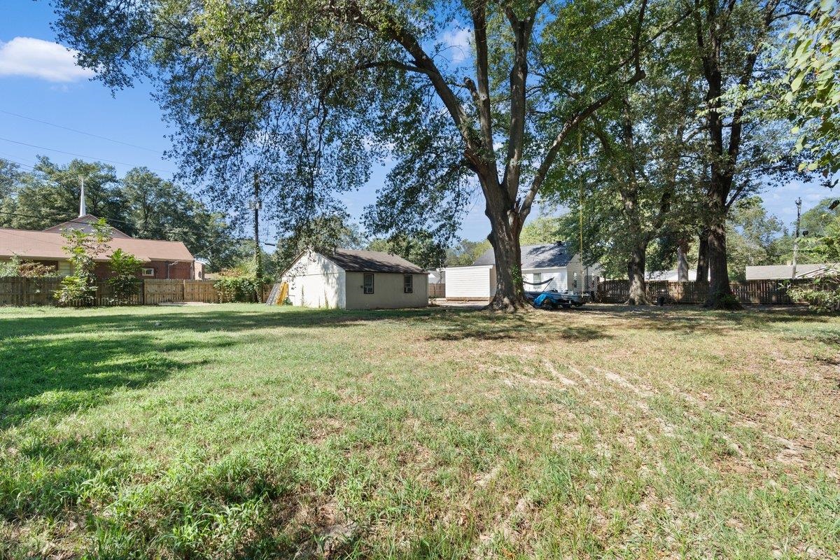 3607 Vanuys Road Memphis, TN 38111 - Photo 25 of 26 a view of a house with backyard and tree