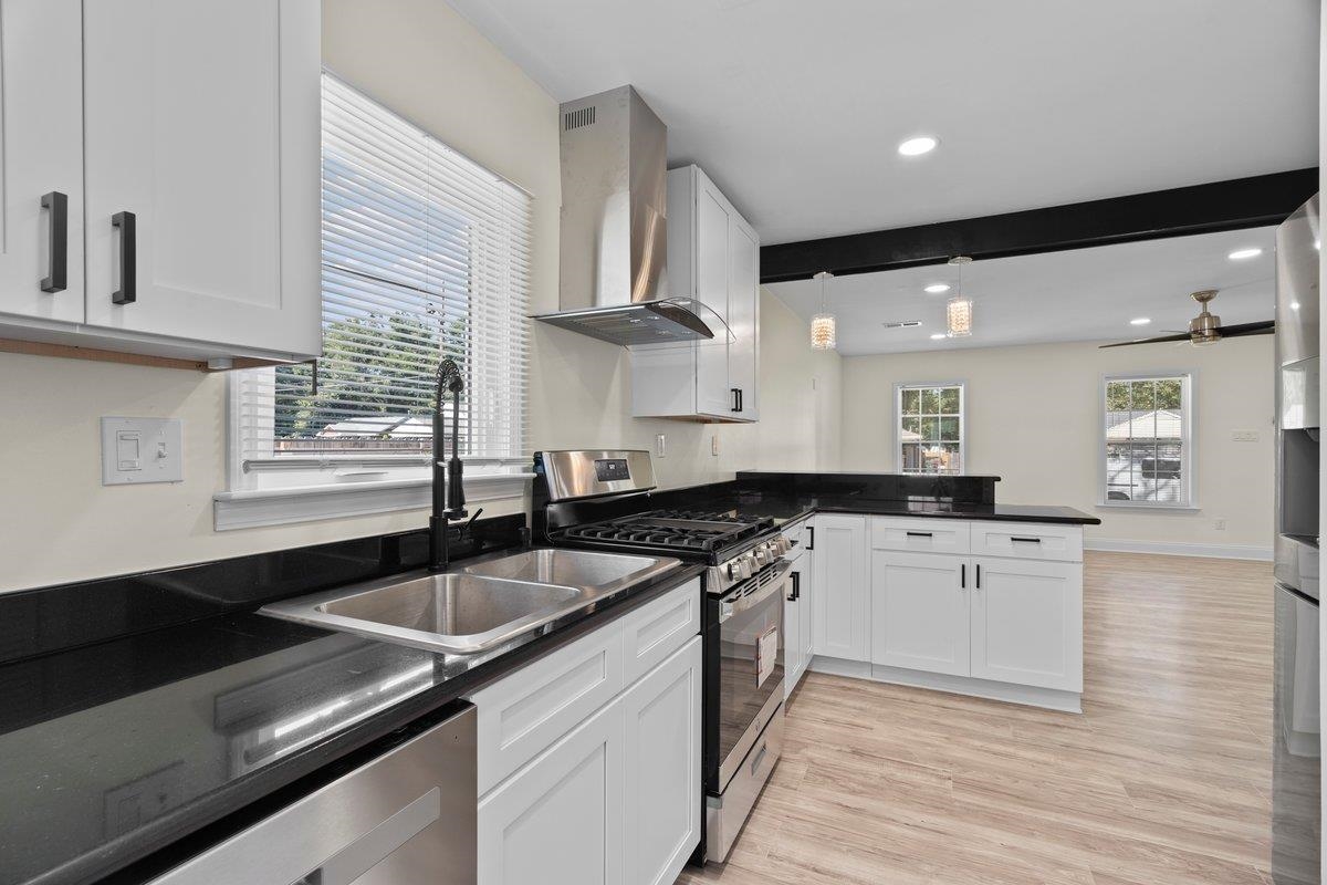 3607 Vanuys Road Memphis, TN 38111 - Photo 5 of 26 a kitchen with granite countertop a sink and cabinets