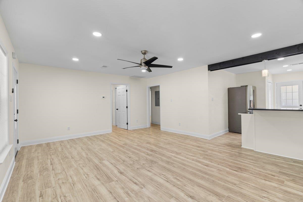 3607 Vanuys Road Memphis, TN 38111 - Photo 7 of 26 a view of empty room with wooden floor and a ceiling fan
