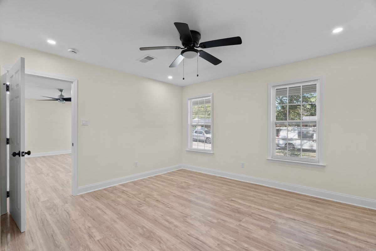 3607 Vanuys Road Memphis, TN 38111 - Photo 8 of 26 wooden floor in an empty room with a window