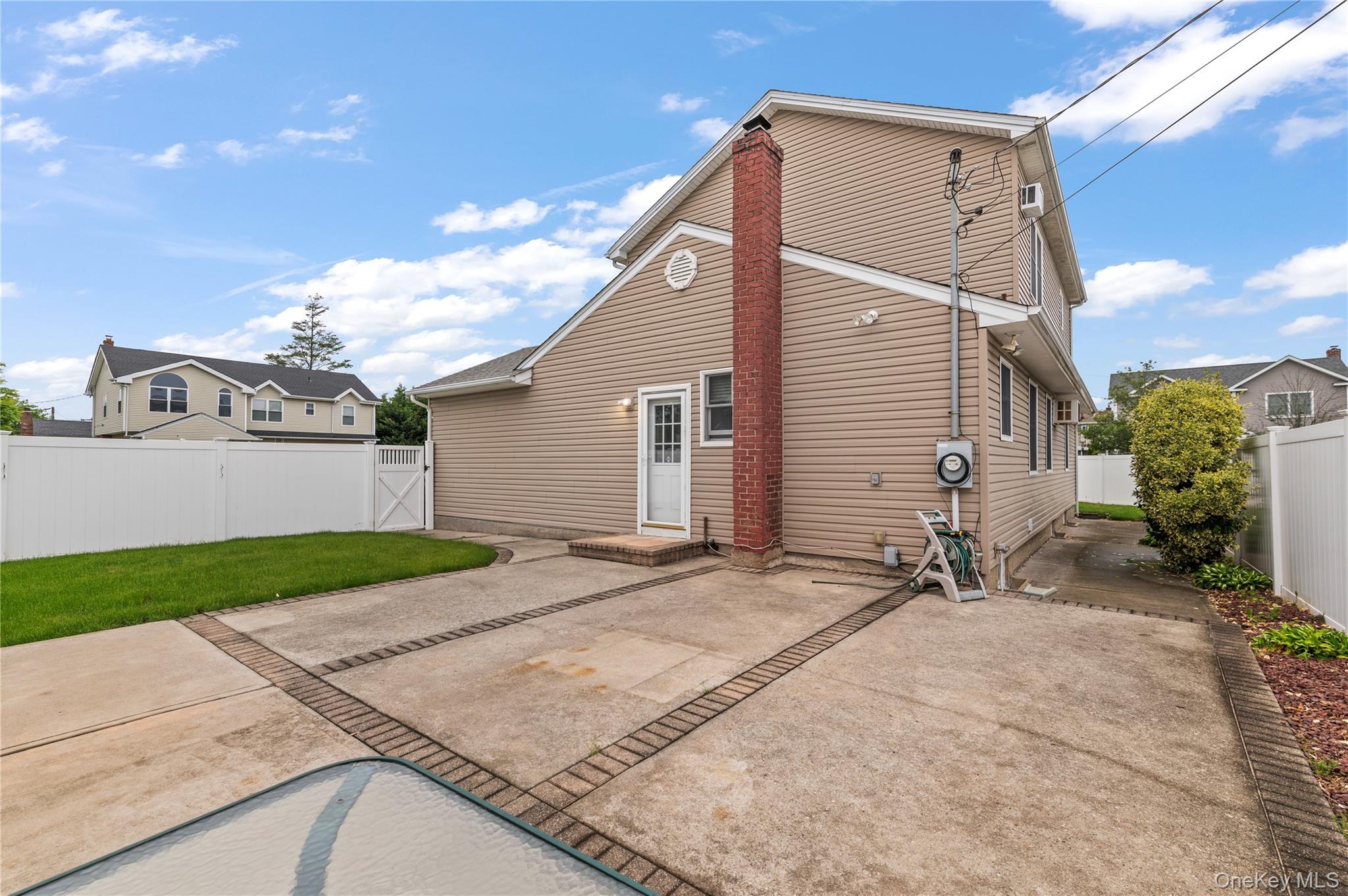 3 Cheshire Road Bethpage, NY 11714 - Photo 25 of 26 a backyard of a house with yard and garage