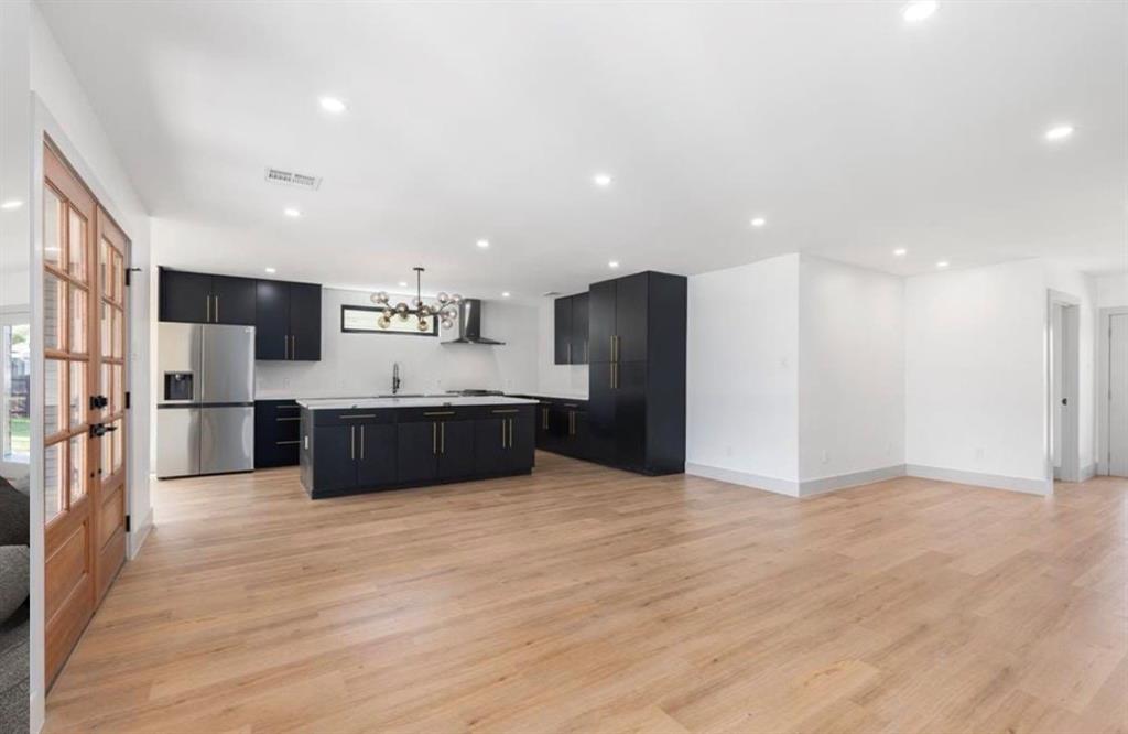 4927 Linnet Lane Dallas, TX 75209 - Photo 15 of 17 a large kitchen with stainless steel appliances granite countertop a large counter top and a refrigerator