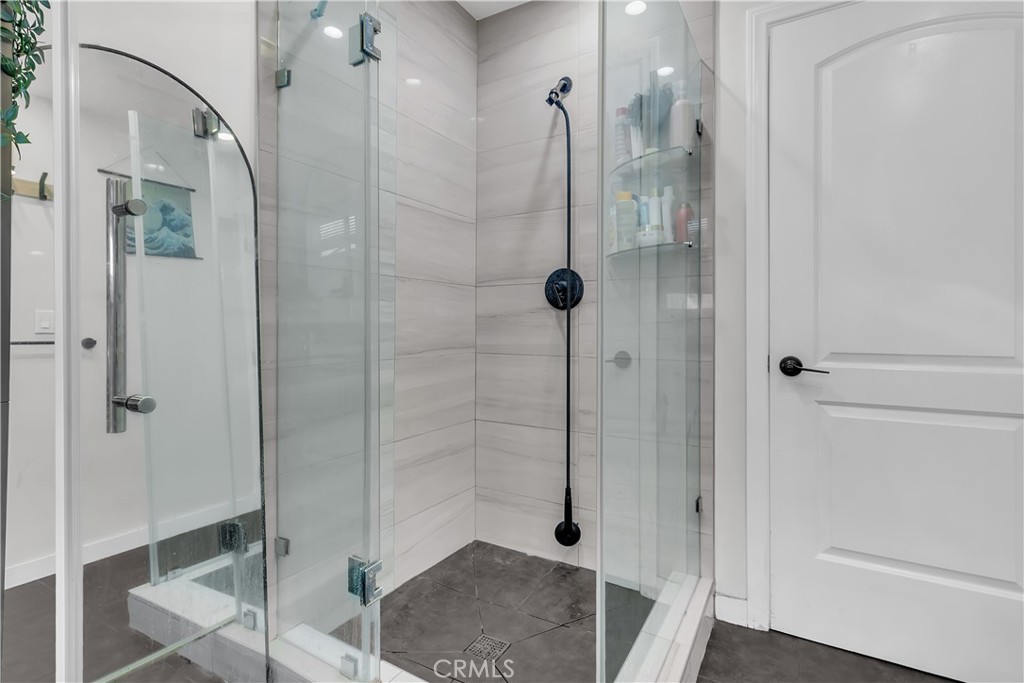 4610 Leonis Street Commerce, CA 90040 - Photo 13 of 32 a bathroom with a shower