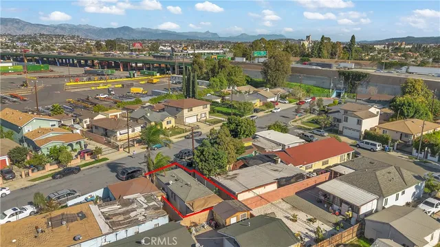 an aerial view of residential houses with outdoor space and river