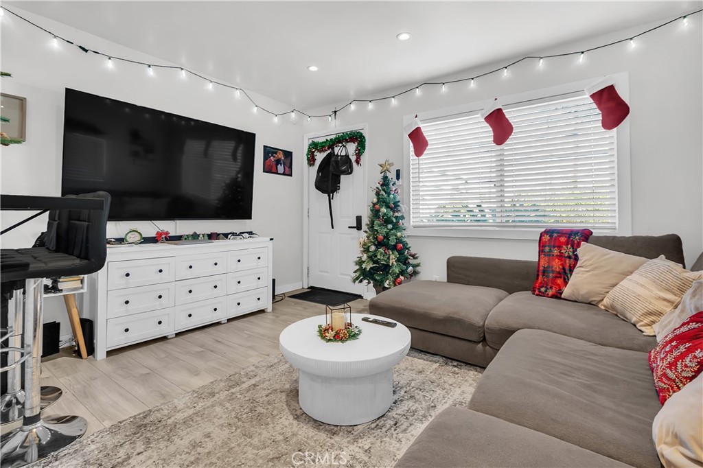 4610 Leonis Street Commerce, CA 90040 - Photo 7 of 32 a living room with furniture and a flat screen tv