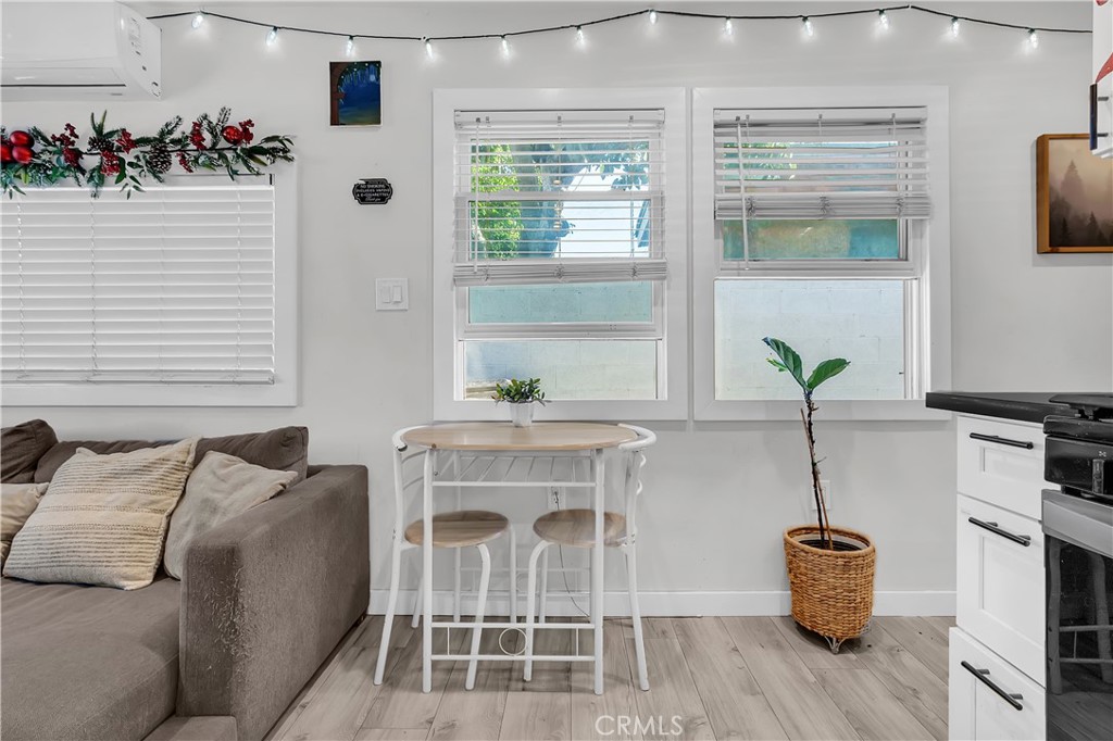 4610 Leonis Street Commerce, CA 90040 - Photo 10 of 32 a white table and chair with wooden floor