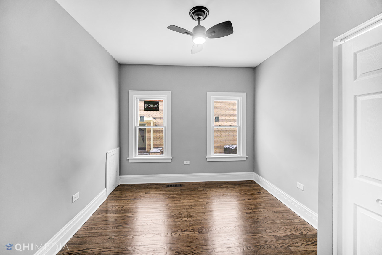 14601 Des Plaines Street Harvey, IL 60426 - Photo 11 of 21 wooden floor in an empty room with a window