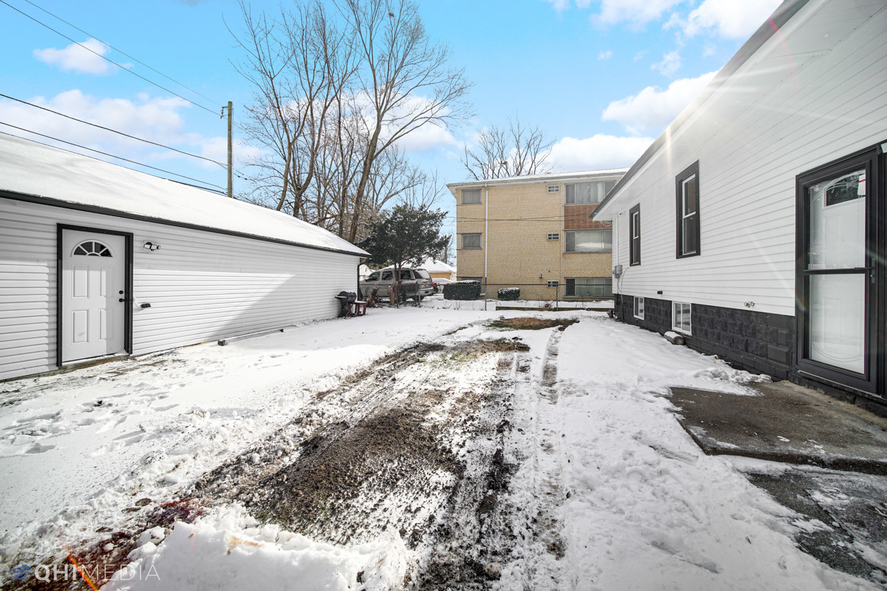 14601 Des Plaines Street Harvey, IL 60426 - Photo 20 of 21 a view of a backyard of a house