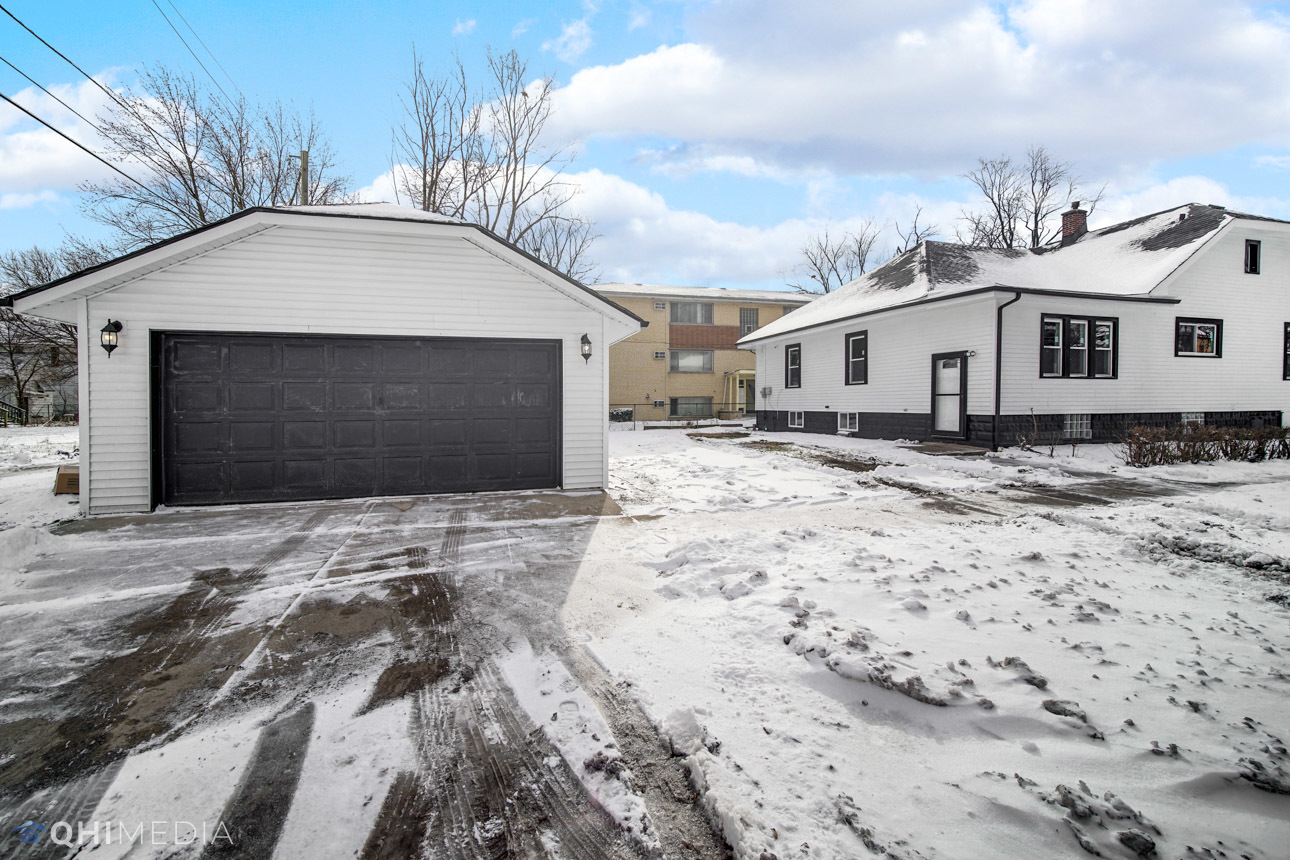 14601 Des Plaines Street Harvey, IL 60426 - Photo 21 of 21 a front view of a house with a yard
