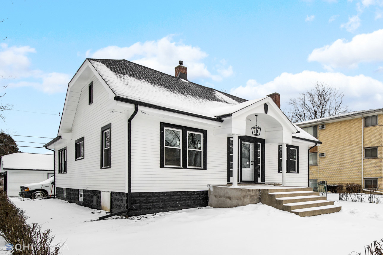 14601 Des Plaines Street Harvey, IL 60426 - Photo 3 of 21 a front view of a house with a yard