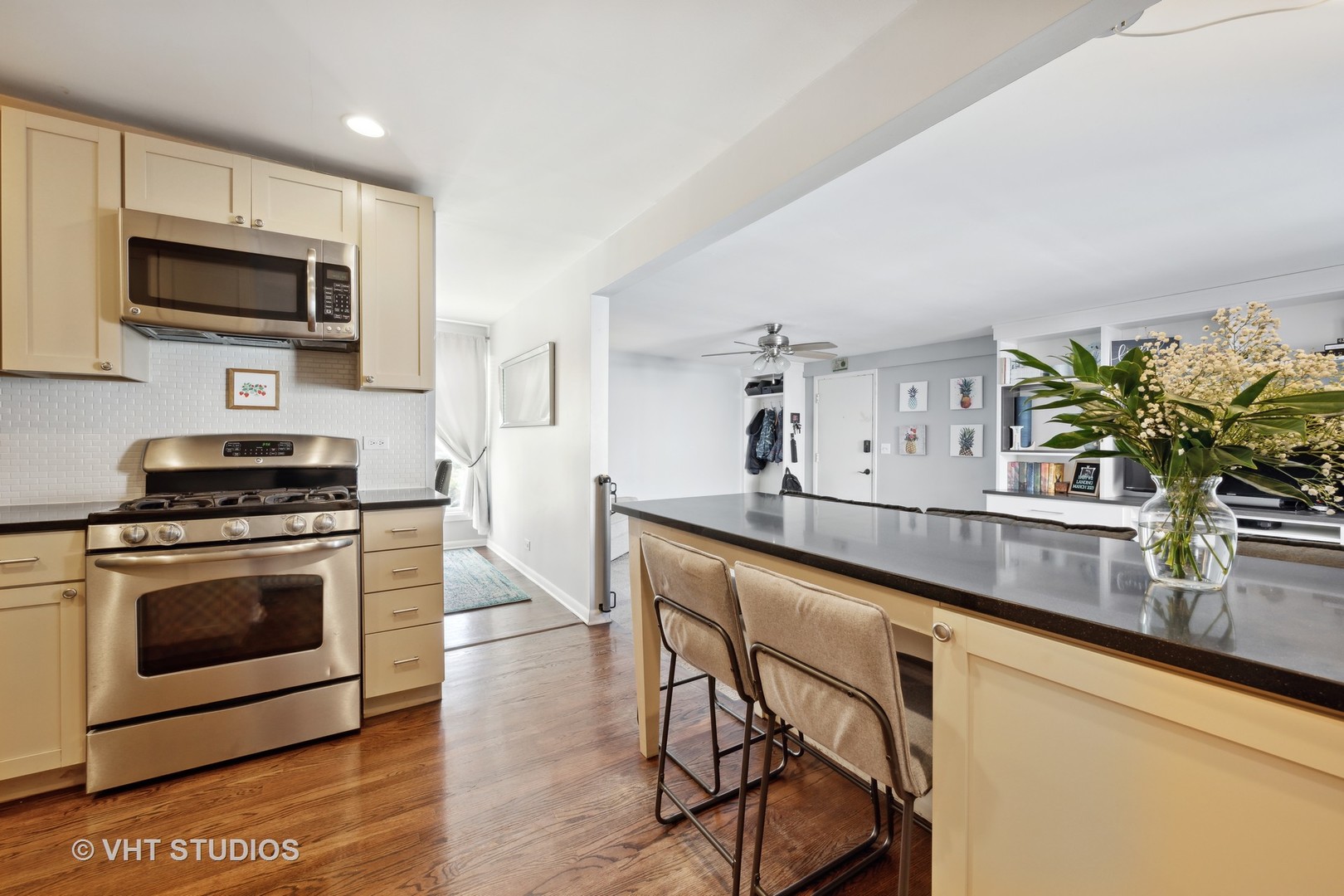 601 Romona Road Wilmette, IL 60091 - Photo 7 of 34 a kitchen with stainless steel appliances a stove a sink a microwave and cabinets