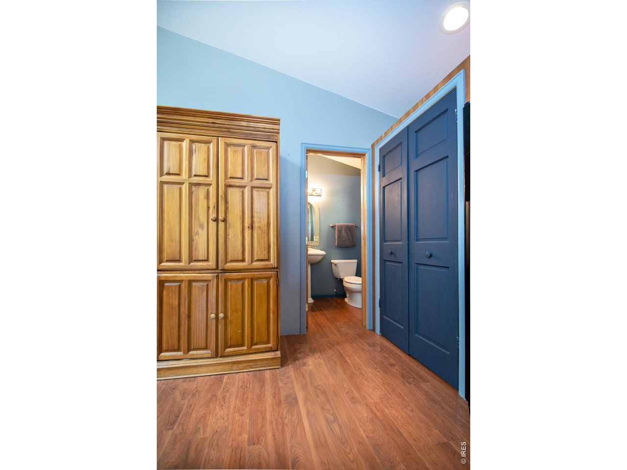3727 Gamble Gulch Road Black Hawk, CO 80422 - Photo 18 of 31 a view of a hallway with wooden floor and a bathroom