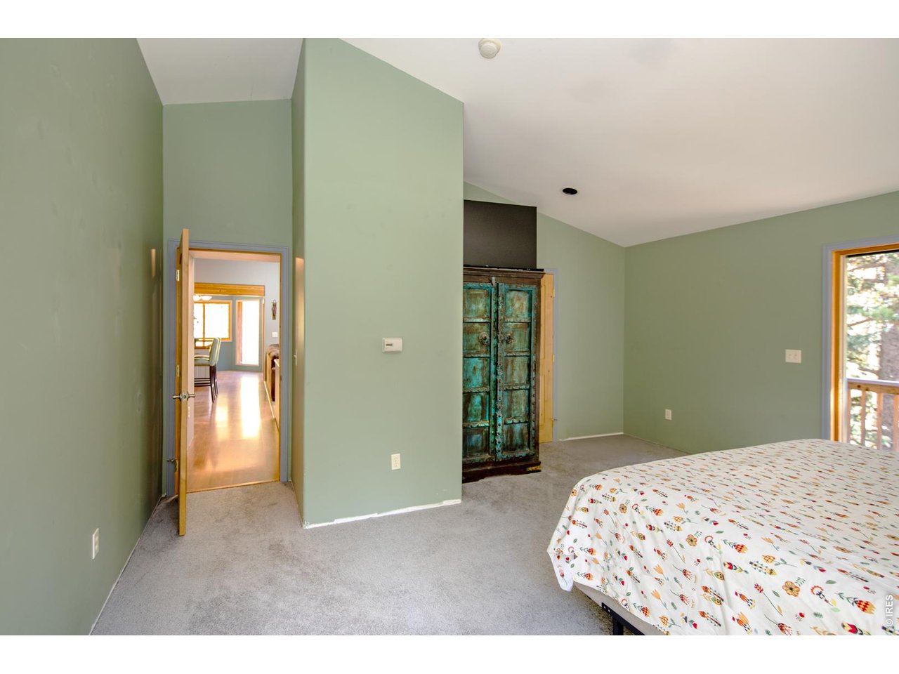 3727 Gamble Gulch Road Black Hawk, CO 80422 - Photo 10 of 31 a bedroom with a bed and a lamp