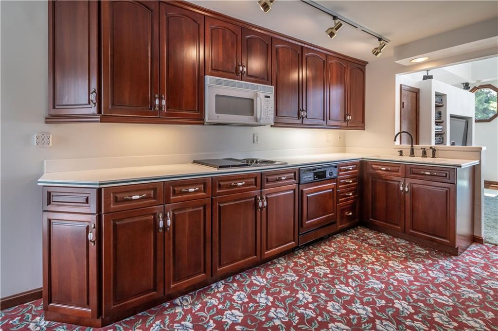 115 Center Church Road Canonsburg, PA 15317 - Photo 11 of 25 Kitchen: recessed lighting, track lighting, under counter lighting. Warm cherry cabinets, corian counters, Genie stove top grill.