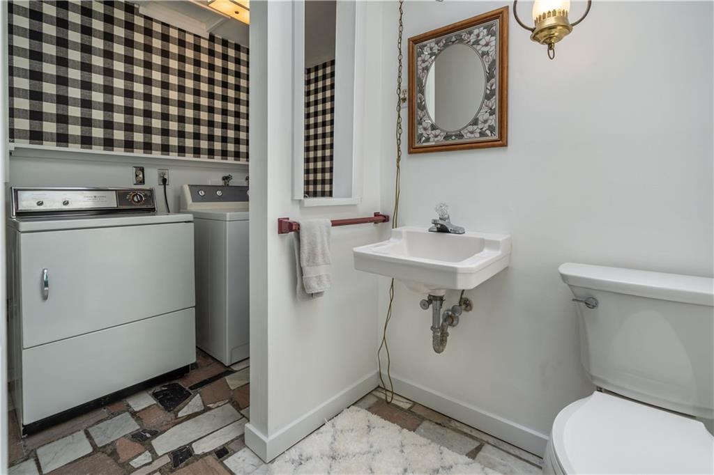 115 Center Church Road Canonsburg, PA 15317 - Photo 13 of 25 Powder room and Laundry: This is located just at the end of kitchen. Clean, convenient and pretty!! this room too has a fantastic skylight.