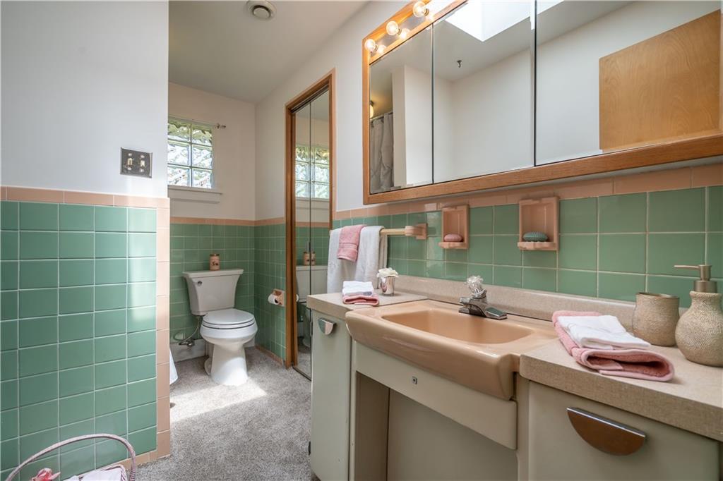 115 Center Church Road Canonsburg, PA 15317 - Photo 14 of 25 Main floor full bath: features spacious Linen closet and there is a soaking tub with shower behind that shower curtain.