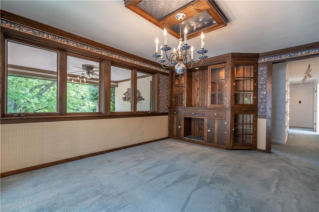 Dining room: Side by side Pella windows, Far left and far right windows open. Dental crown molding, Custom built in China cabinet.