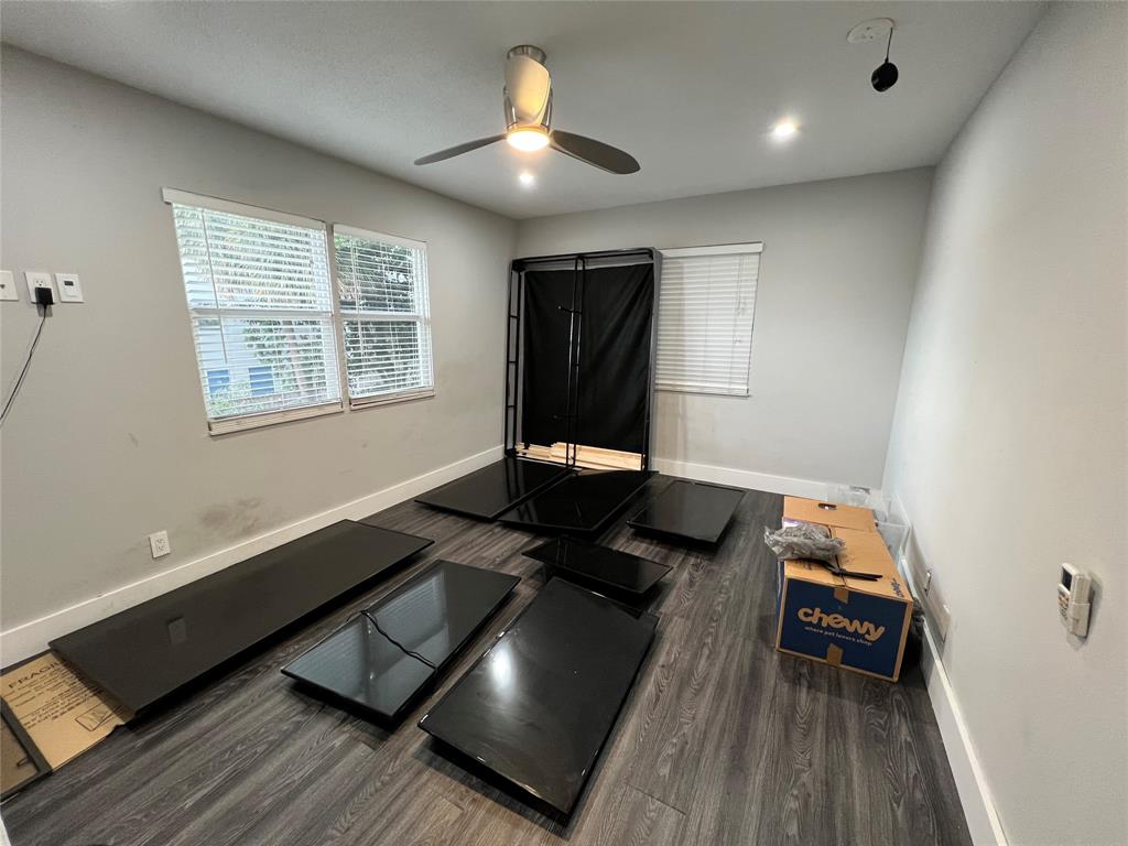 1410 Northeast 56th Court, Unit 1410 Fort Lauderdale, FL 33334 - Photo 11 of 14 a living room with furniture and a window