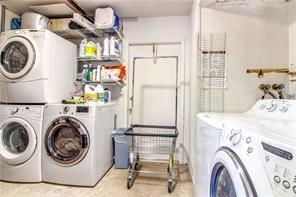 1410 Northeast 56th Court, Unit 1410 Fort Lauderdale, FL 33334 - Photo 13 of 14 a utility room with dryer and washer