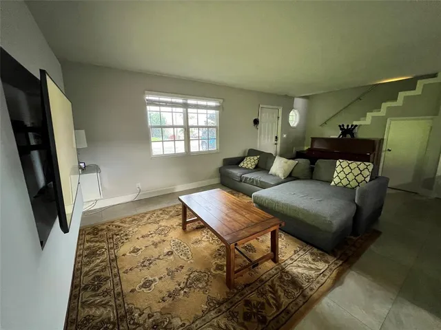 a bedroom with a bed and ceiling fan