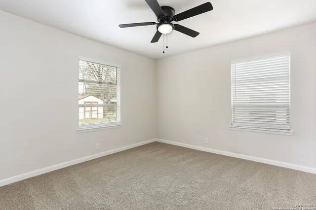 a view of an empty room with a window