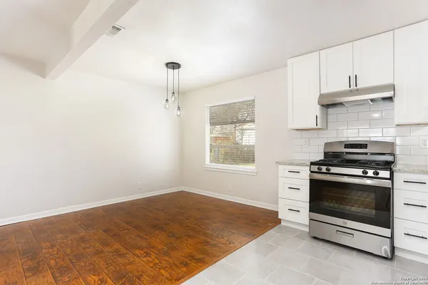 a kitchen with a stove and a kitchen