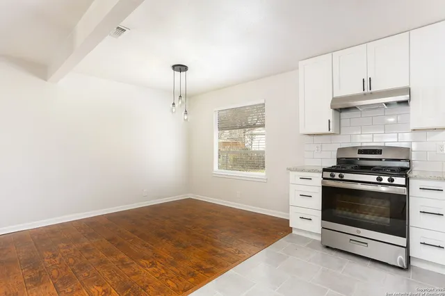 a kitchen with a stove and a kitchen