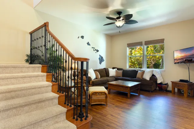 a living room with fireplace furniture and a wooden floor