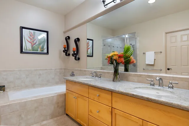 a bathroom with a granite countertop sink mirror and vanity