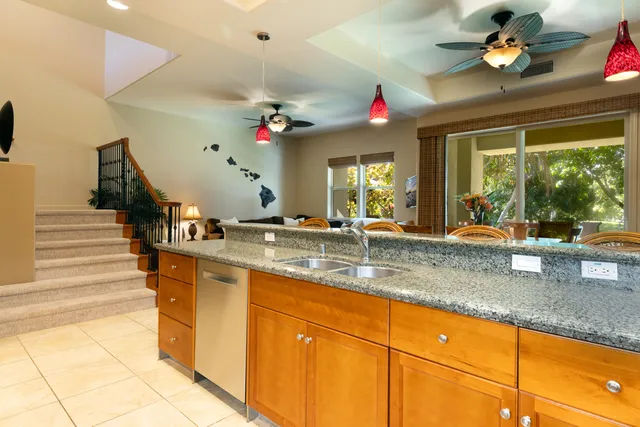 a view of living room with granite countertop furniture and a large window