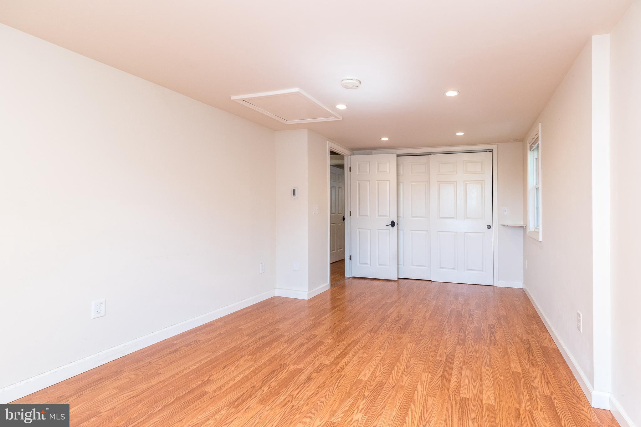 2478 River Road, Unit CARRIAGE New Hope, PA 18938 - Photo 12 of 23 a view of a big room with wooden floor and windows