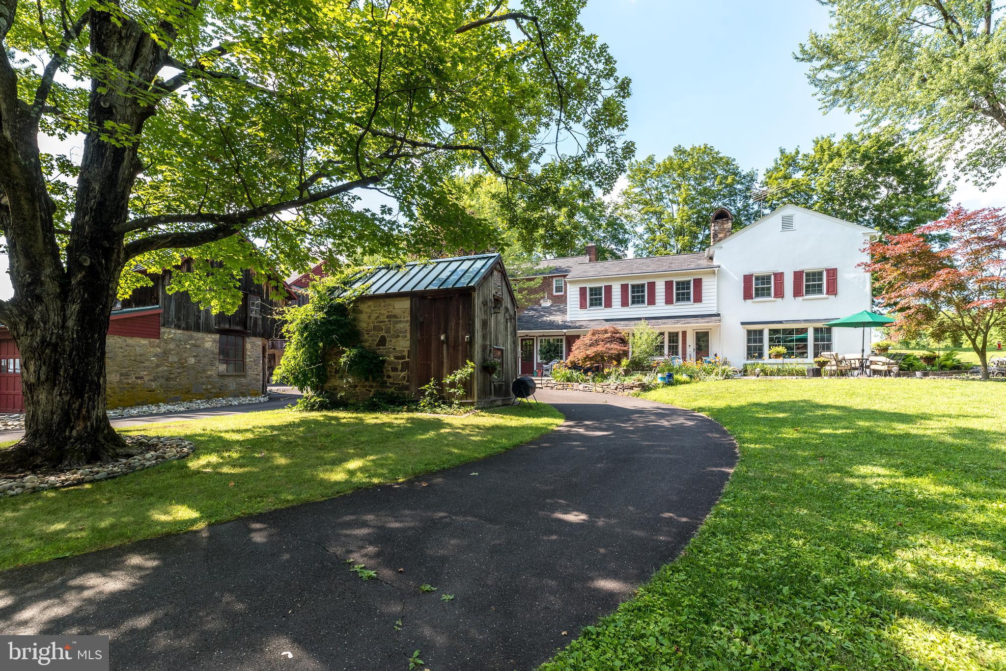 2478 River Road, Unit CARRIAGE New Hope, PA 18938 - Photo 23 of 23 a front view of a house with yard porch and outdoor seating
