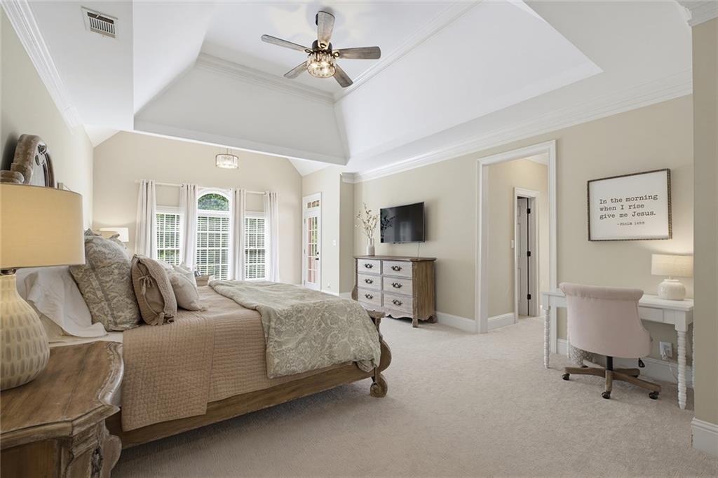 14442 Club Circle Milton, GA 30004 - Photo 28 of 82 a bedroom with a bed a chair and large mirror