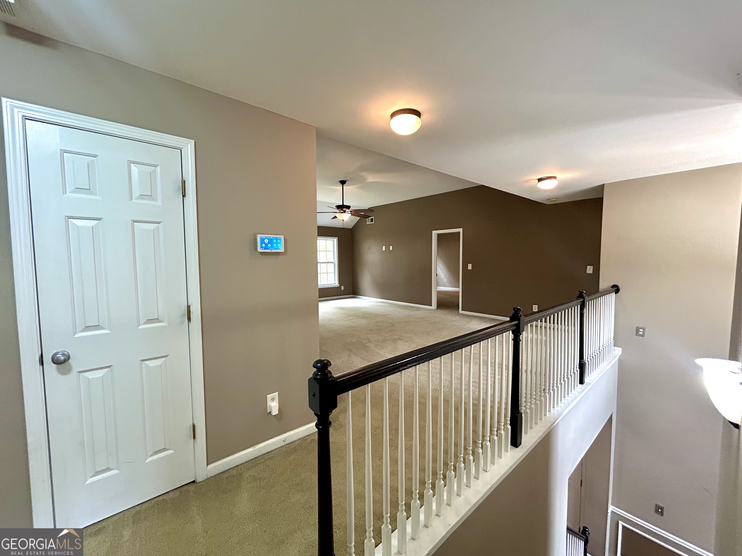 7613 Cedar Grove Court Fairburn, GA 30213 - Photo 11 of 61 a view of a hallway with staircase