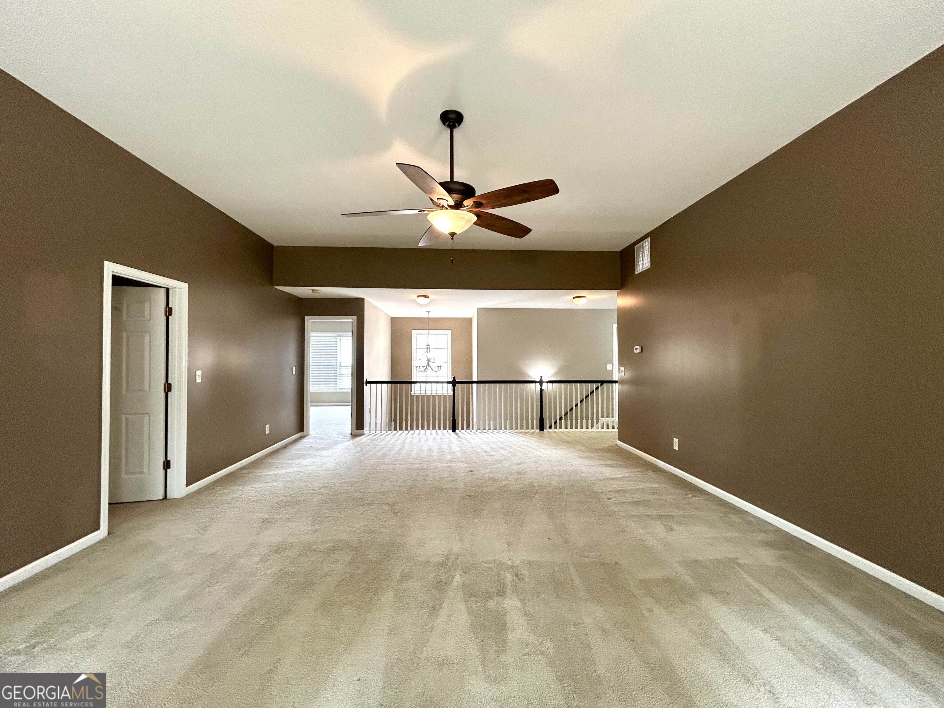 7613 Cedar Grove Court Fairburn, GA 30213 - Photo 16 of 61 a view of a livingroom with a ceiling fan