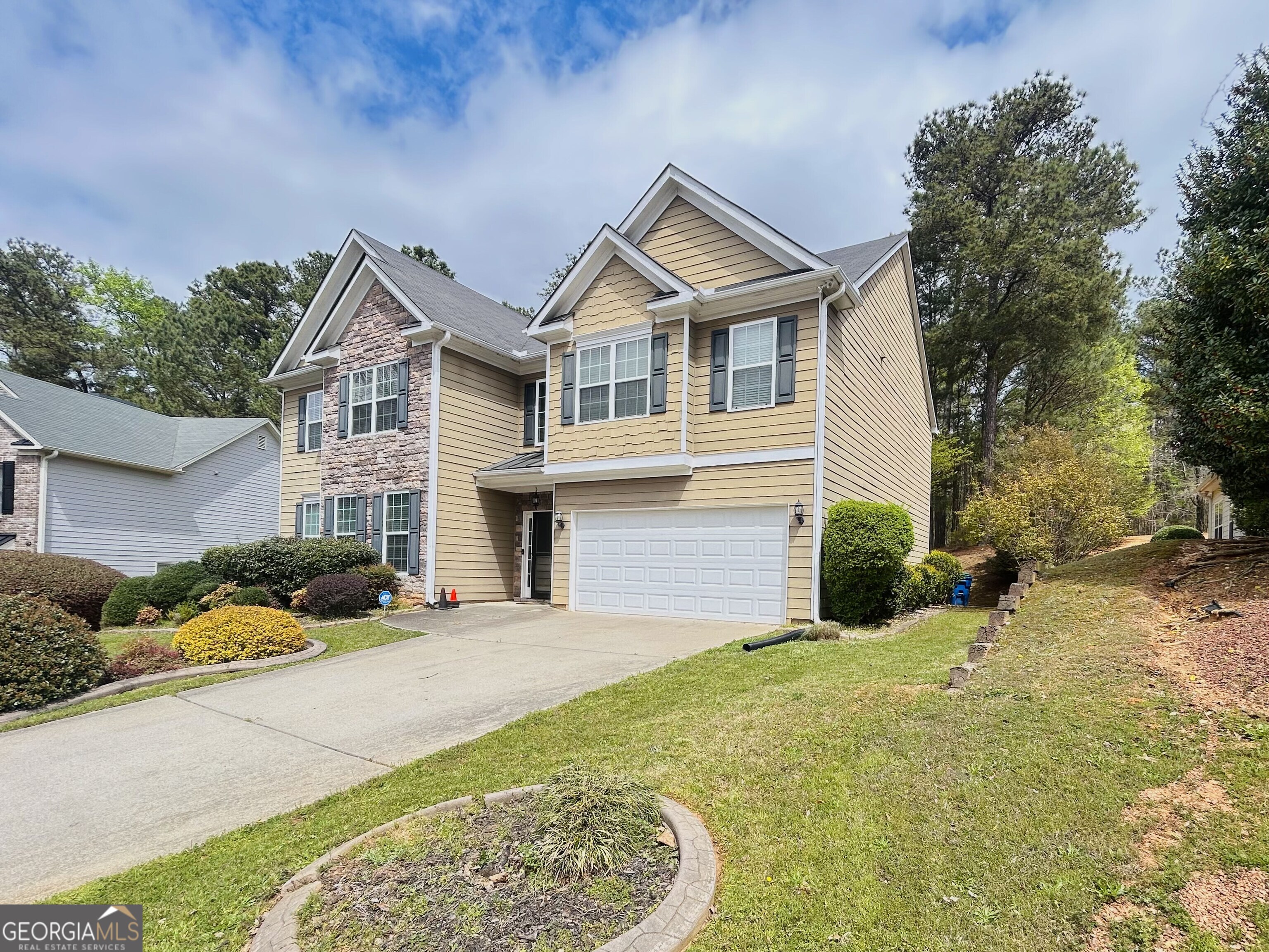 7613 Cedar Grove Court Fairburn, GA 30213 - Photo 2 of 61 a front view of a house with a yard and garage