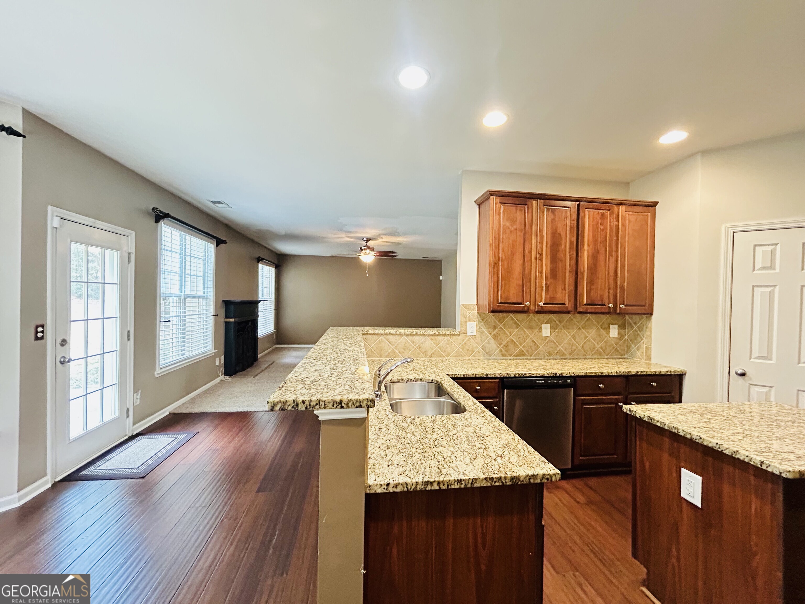 7613 Cedar Grove Court Fairburn, GA 30213 - Photo 22 of 61 a kitchen with a sink stove and cabinets