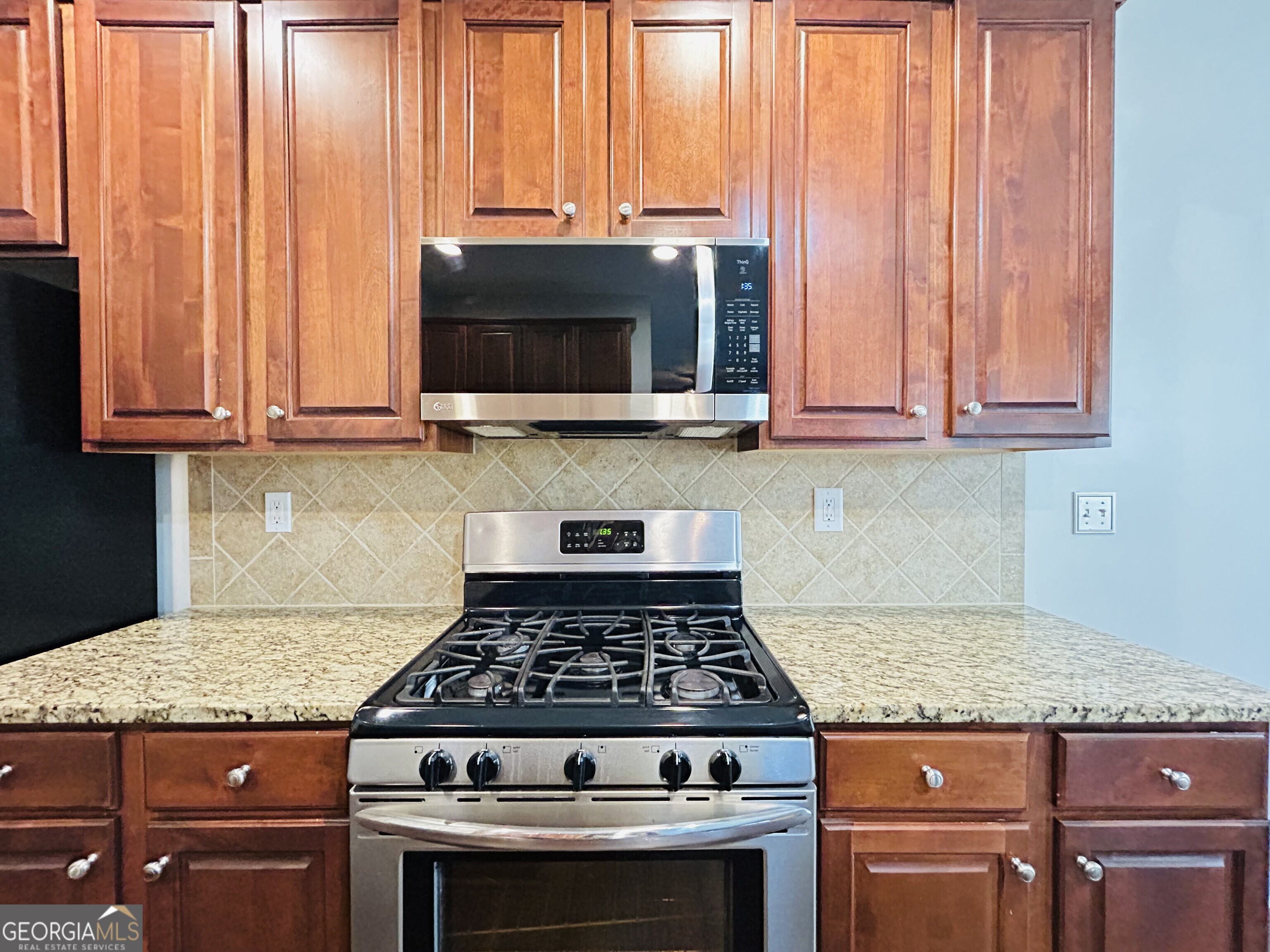 7613 Cedar Grove Court Fairburn, GA 30213 - Photo 27 of 61 a stove top oven sitting inside of a kitchen
