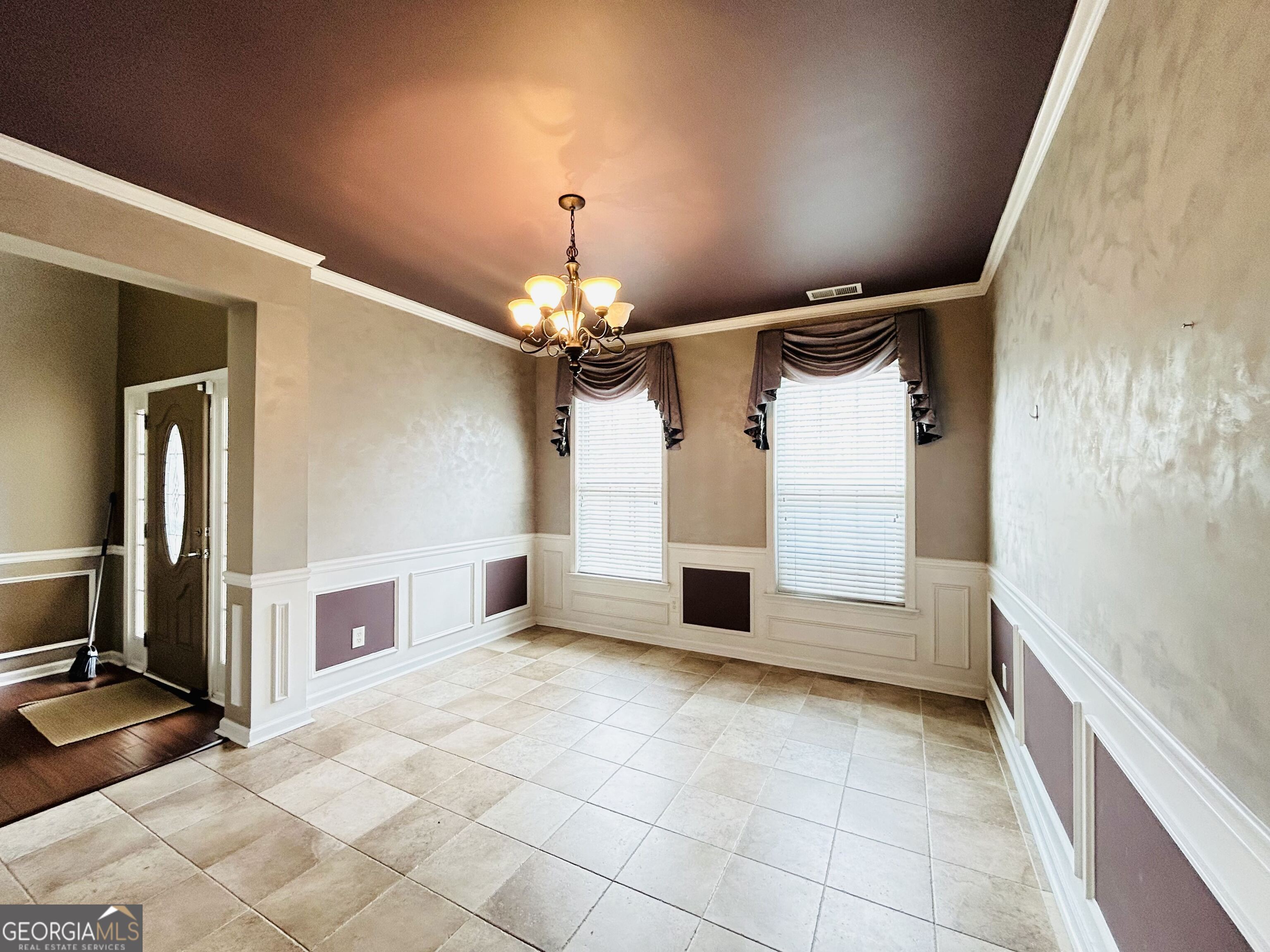 7613 Cedar Grove Court Fairburn, GA 30213 - Photo 31 of 61 a view of an empty room with a fireplace and a chandelier