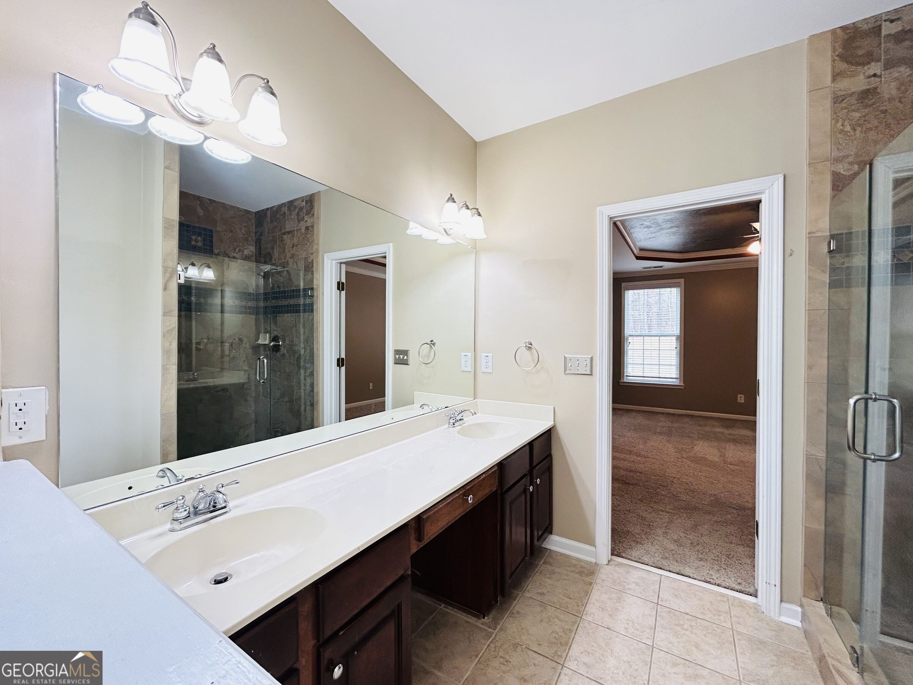 7613 Cedar Grove Court Fairburn, GA 30213 - Photo 36 of 61 a bathroom with a sink a light fixture and a mirror