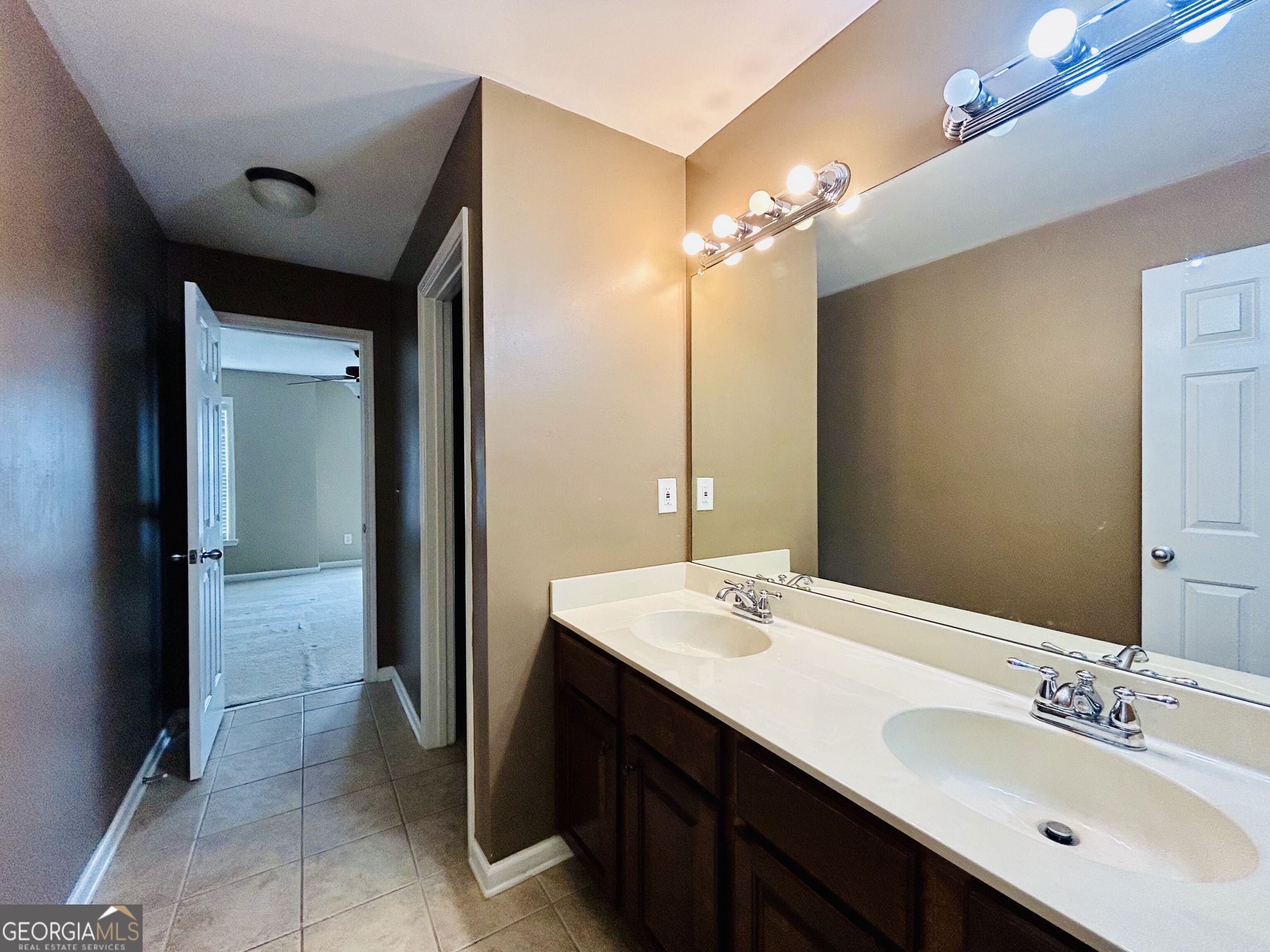 7613 Cedar Grove Court Fairburn, GA 30213 - Photo 46 of 61 a bathroom with a double vanity sink mirror and shower