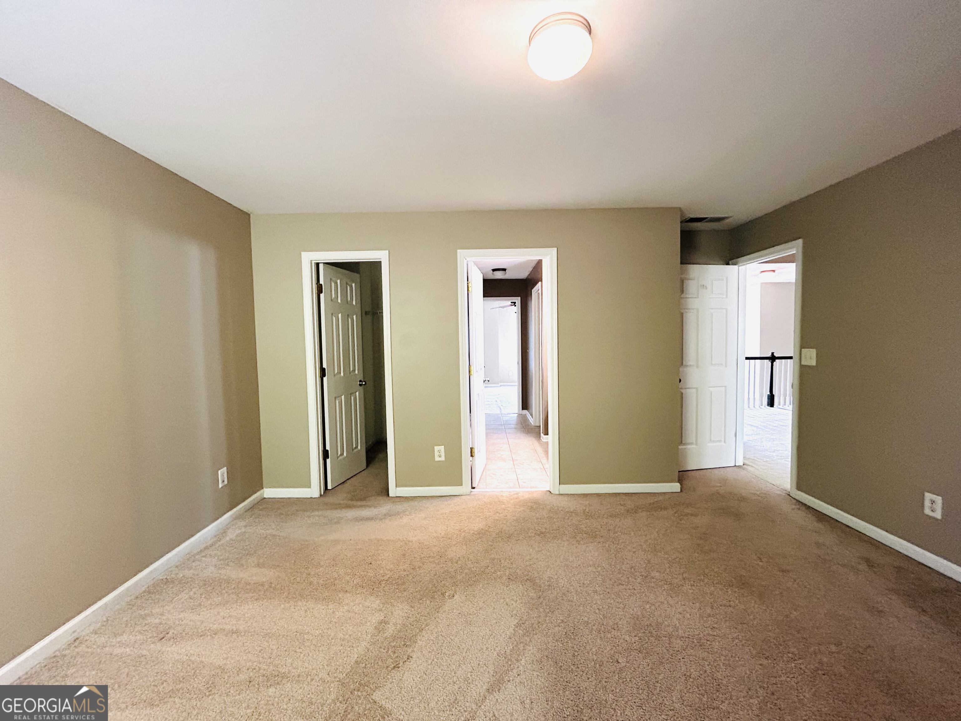 7613 Cedar Grove Court Fairburn, GA 30213 - Photo 48 of 61 an empty room with closet and a window